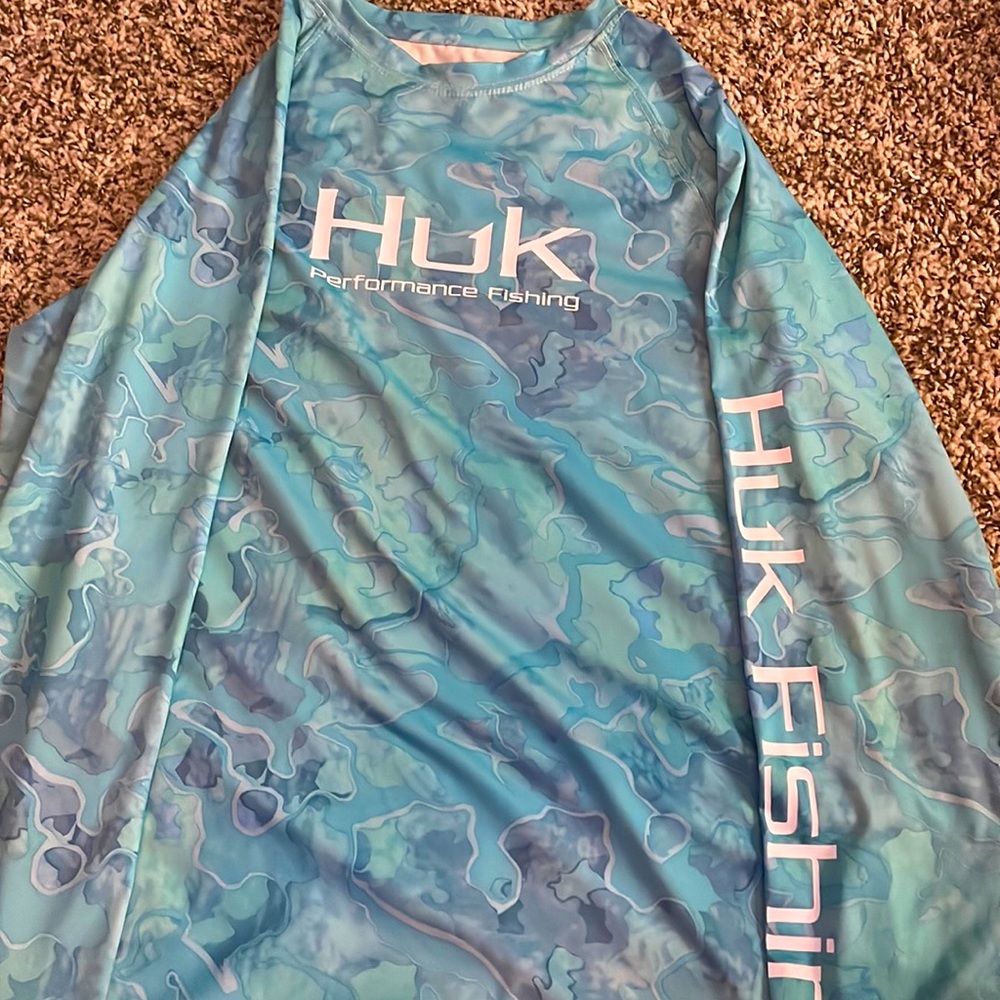 The brand of the shirt is hog fishing and it is a youth large.